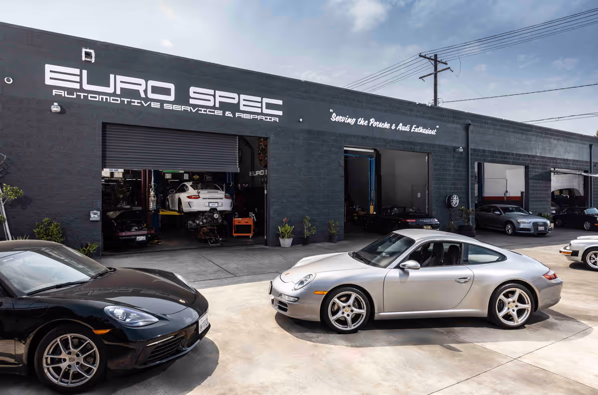 Euro Spec Motoring’s black building and open service bays on West Pico Boulevard